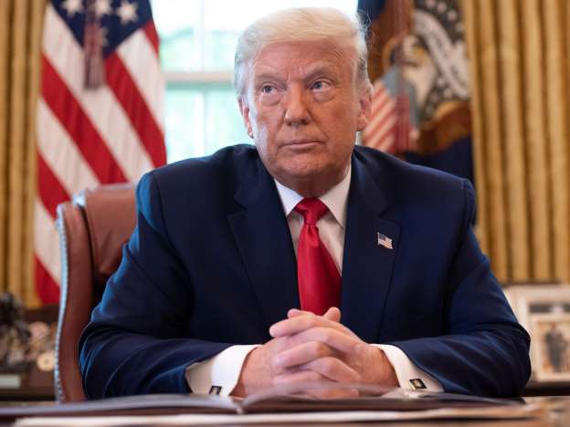 Donald Trump wearing a suit and tie: President Donald Trump speaks during an event commemorating the repatriation of Native American remains and artifacts from Finland in the Oval Office of the White House in Washington, DC, September 17, 2020. SAUL LOEB/AFP via Getty Images